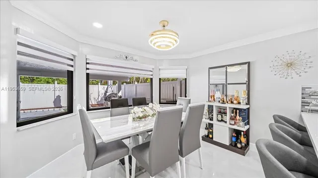 a view of a dining room with furniture window and outside view