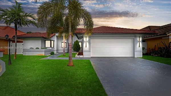 a front view of house with yard and green space