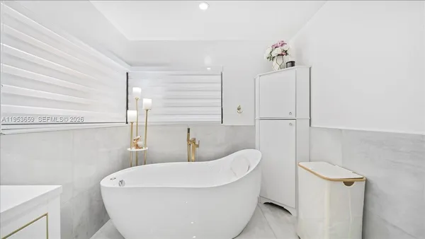 a bathroom with a sink a toilet and tub