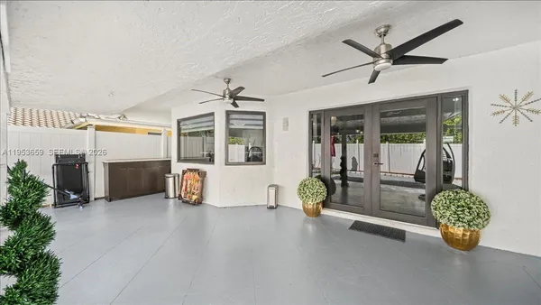 a view of a livingroom with furniture and a ceiling fan