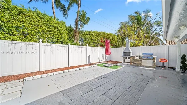 a view of balcony with wooden floor and fence