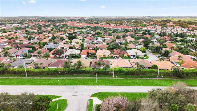 an aerial view of a city with lots of buildings and trees