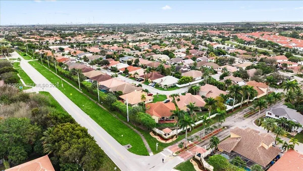 an aerial view of residential houses with outdoor space