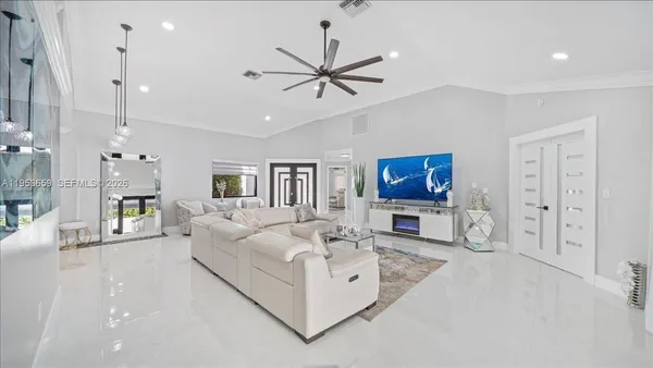a living room with furniture and a flat screen tv