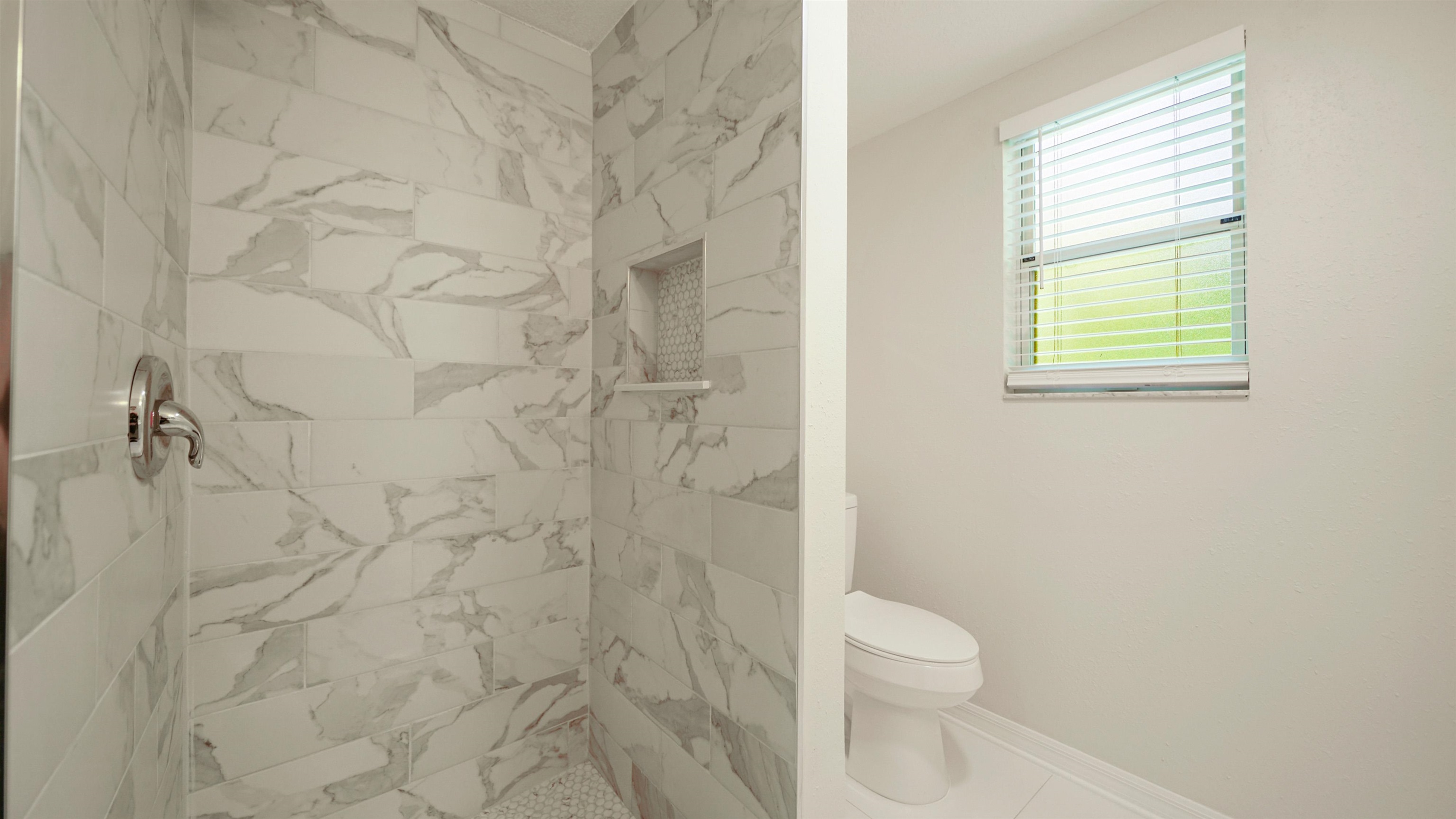 11734 Wynell Road Jacksonville, FL 32218 - Photo 17 of 27 a bathroom with a toilet and a shower