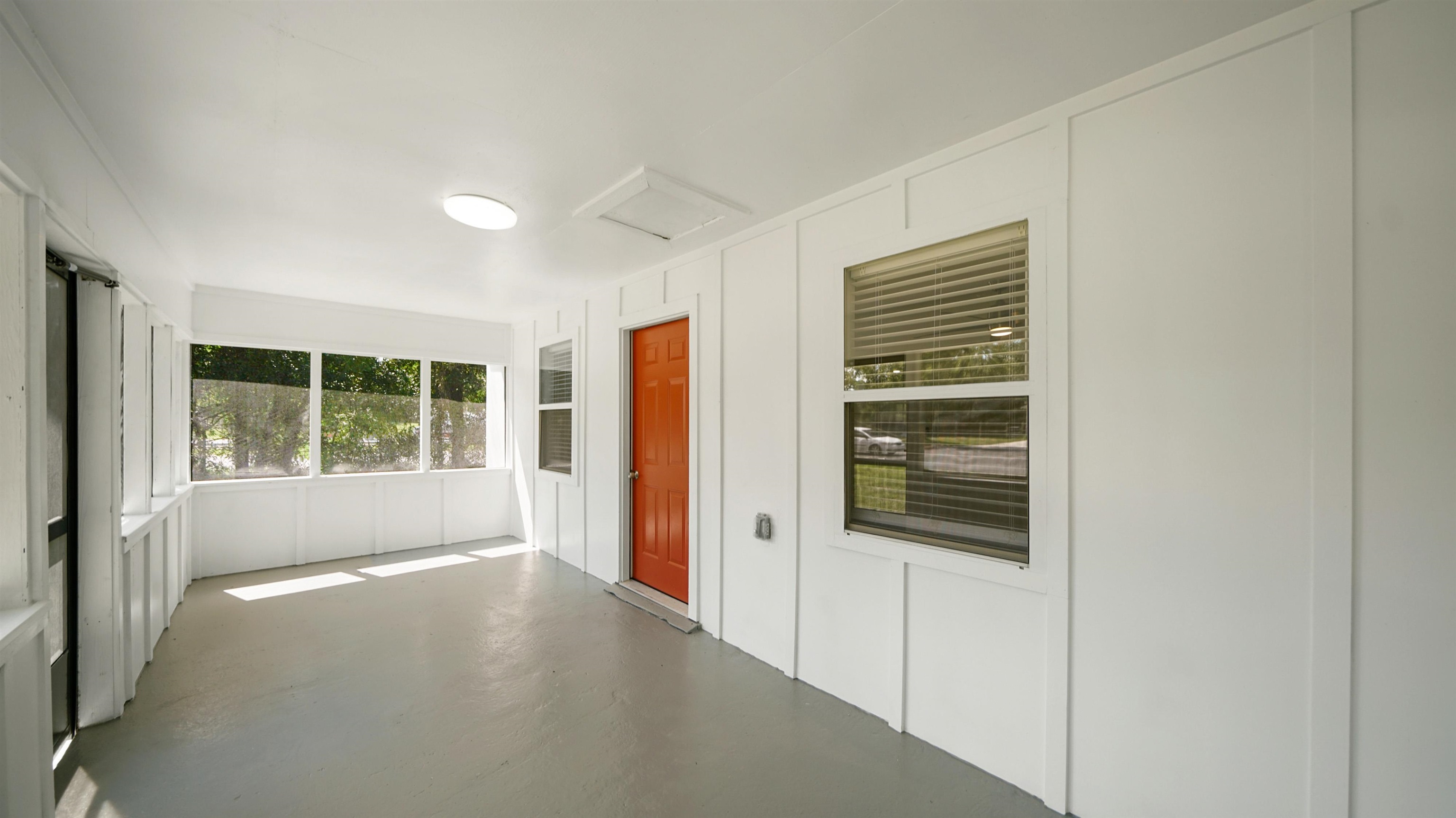 11734 Wynell Road Jacksonville, FL 32218 - Photo 2 of 27 a view of a hallway with windows