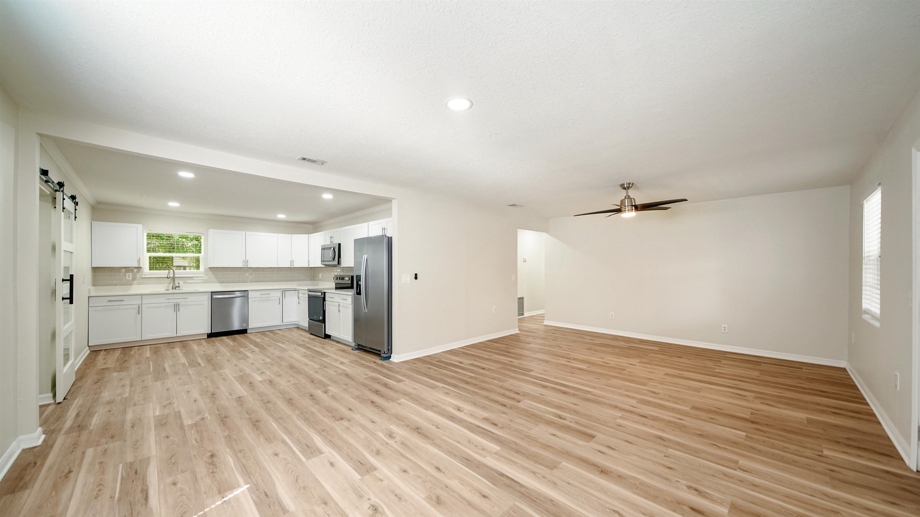 11734 Wynell Road Jacksonville, FL 32218 - Photo 3 of 27 a view of a kitchen with wooden floor