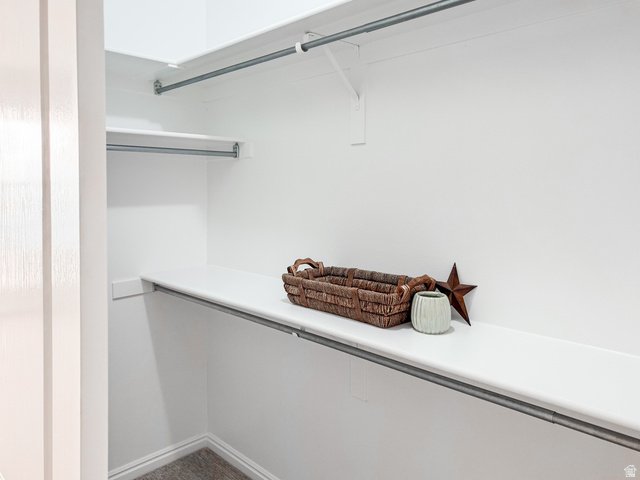 2158 Balboa Way St. George, UT 84770 - Photo 19 of 40 White closet system featuring multiple shelves and hanging rods