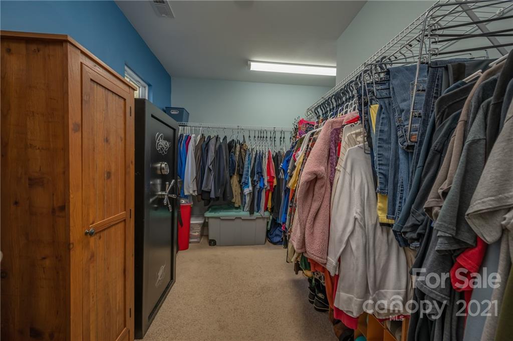 140 Cold Springs Road Hendersonville, NC 28792 - Photo 14 of 30 a view of walk in closet with clothes