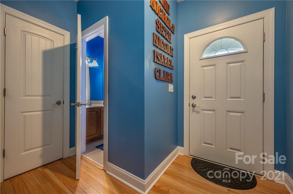 140 Cold Springs Road Hendersonville, NC 28792 - Photo 3 of 30 a view of a hallway with wooden floor and closet
