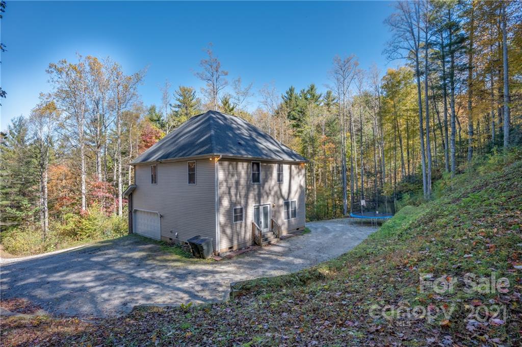 140 Cold Springs Road Hendersonville, NC 28792 - Photo 22 of 30 a view of a house with yard and trees