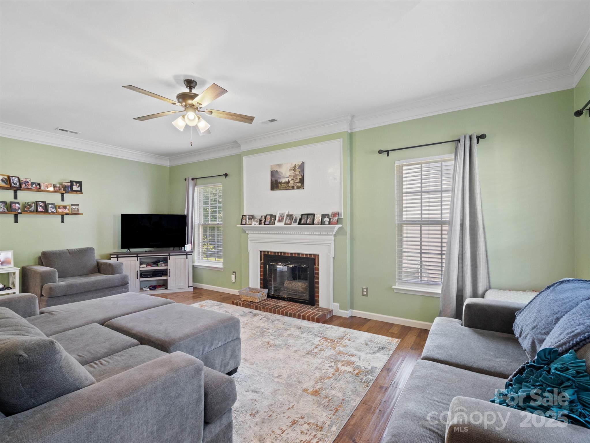 5535 Whispering Wind Lane Indian Trail, NC 28079 - Photo 6 of 25 a living room with furniture or fireplace and a flat screen tv