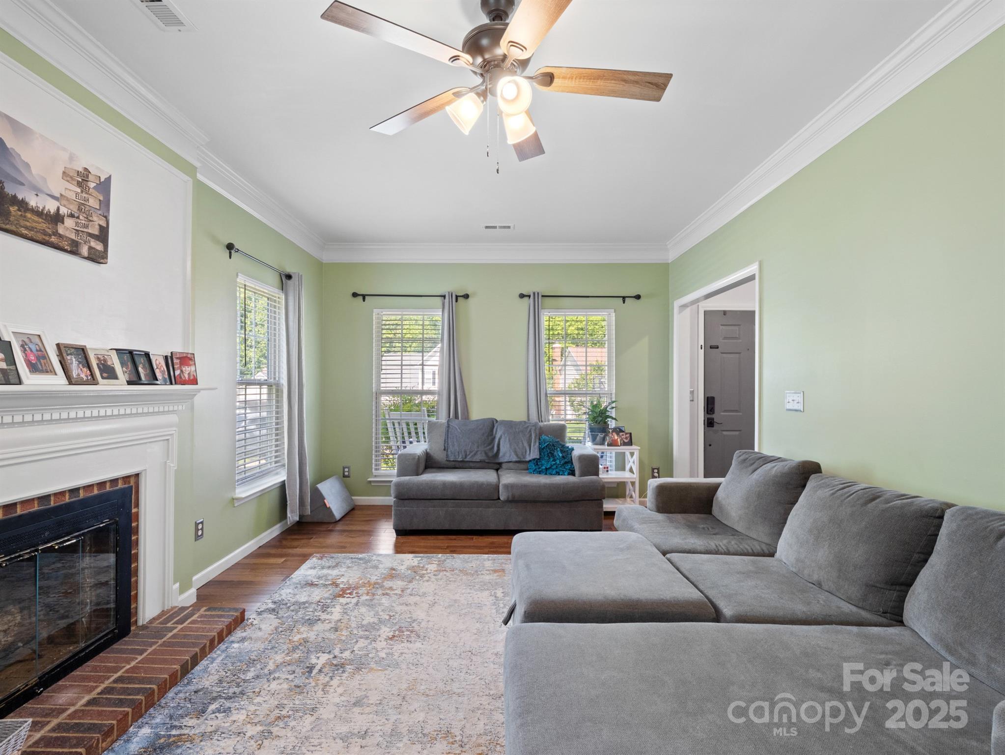 5535 Whispering Wind Lane Indian Trail, NC 28079 - Photo 8 of 25 a living room with furniture and a fireplace