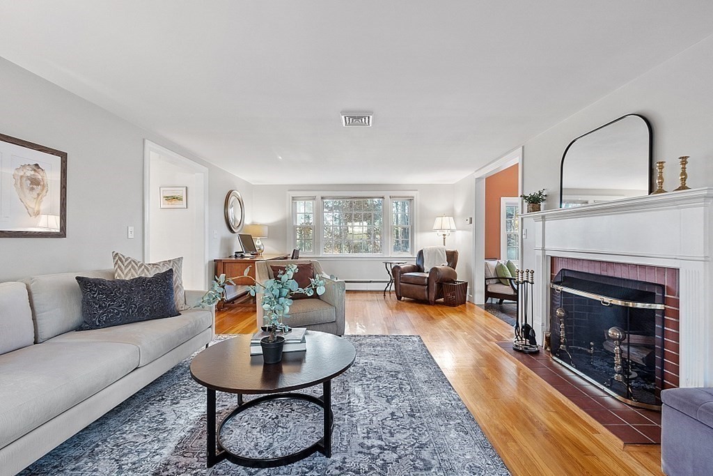 2 Joseph Reed Lane Acton, MA 01720 - Photo 14 of 42 a living room with furniture a fireplace and a table