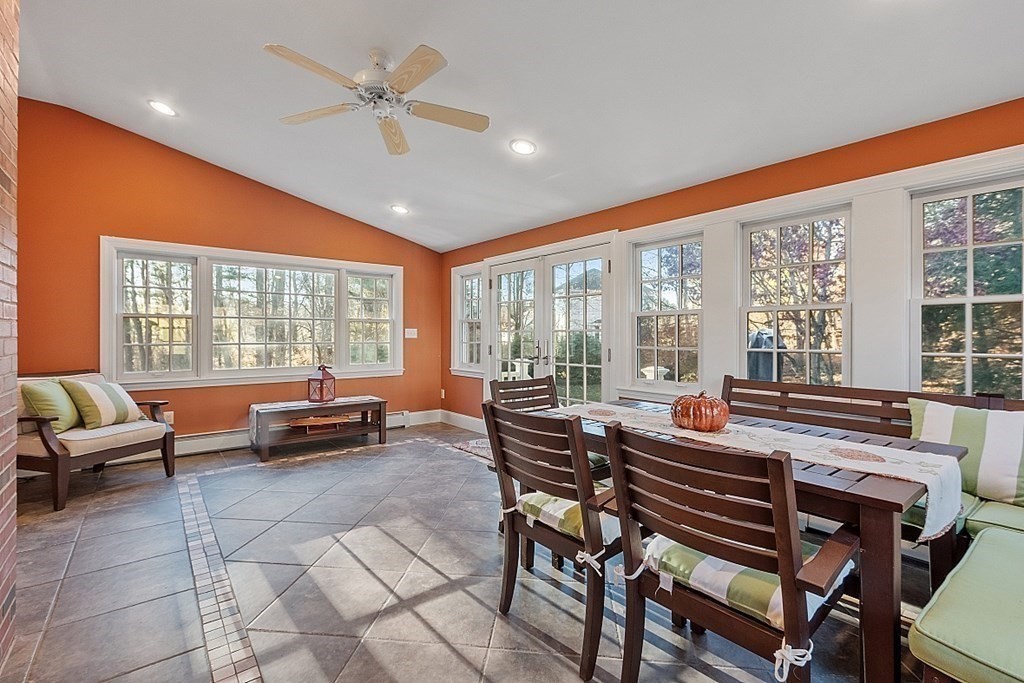 2 Joseph Reed Lane Acton, MA 01720 - Photo 15 of 42 a living room with furniture and a floor to ceiling window