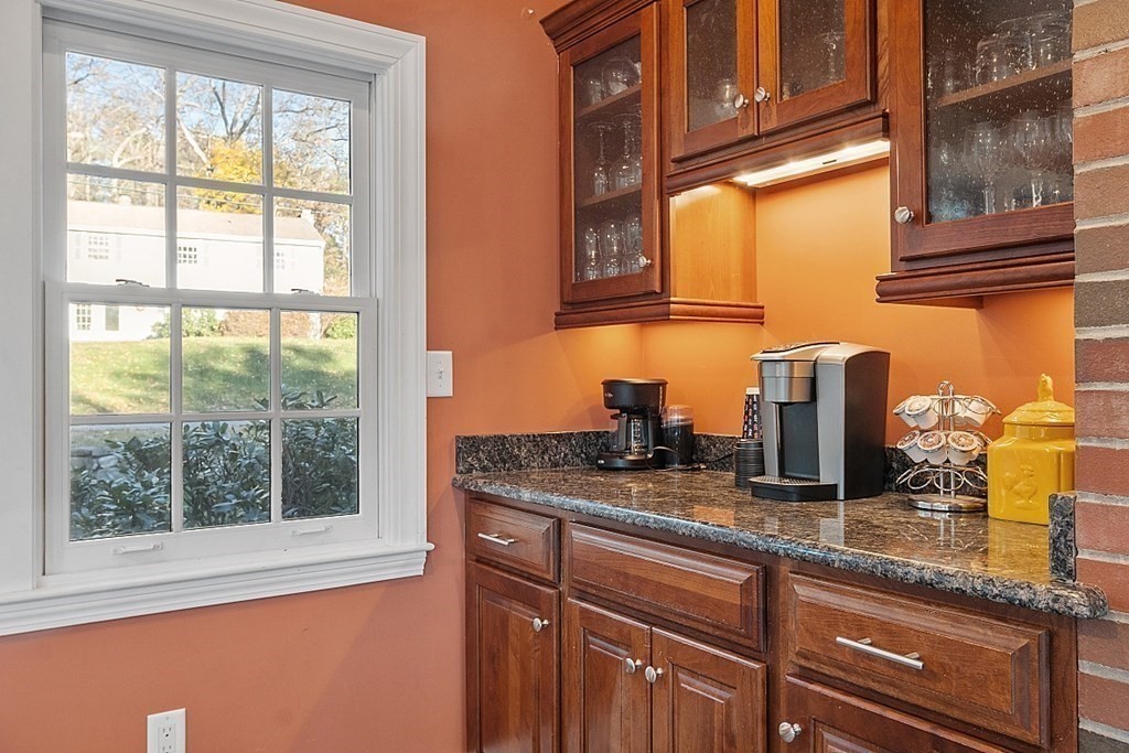 2 Joseph Reed Lane Acton, MA 01720 - Photo 16 of 42 a kitchen with granite countertop a sink and a window