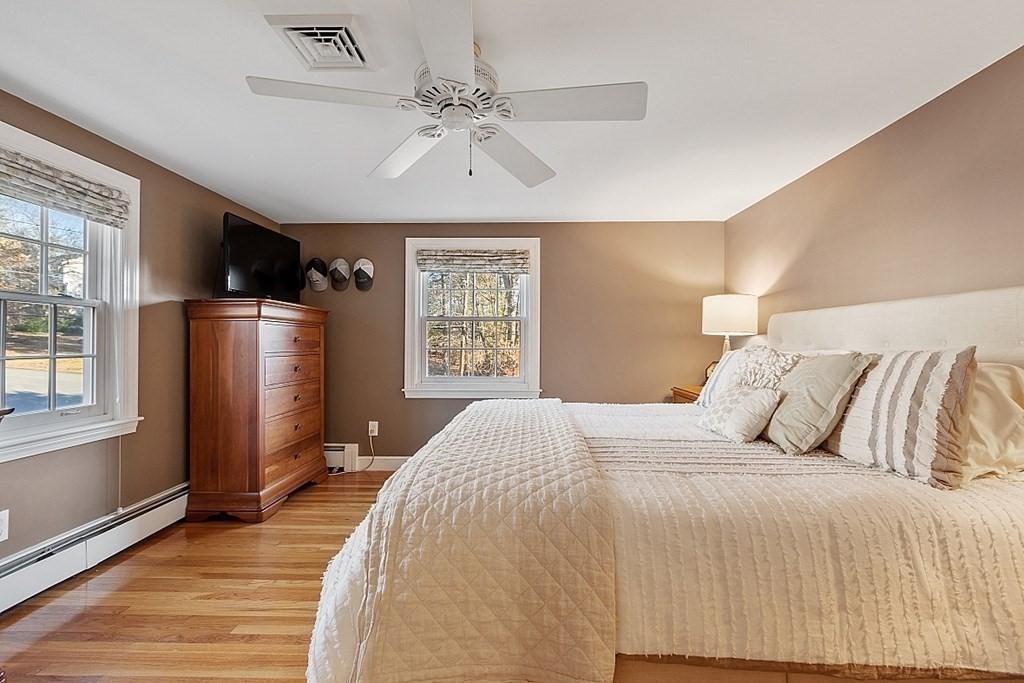2 Joseph Reed Lane Acton, MA 01720 - Photo 22 of 42 a bedroom with a large bed and a window