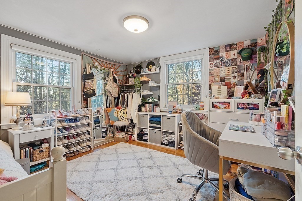 2 Joseph Reed Lane Acton, MA 01720 - Photo 28 of 42 a room with furniture a flat screen tv and a large window
