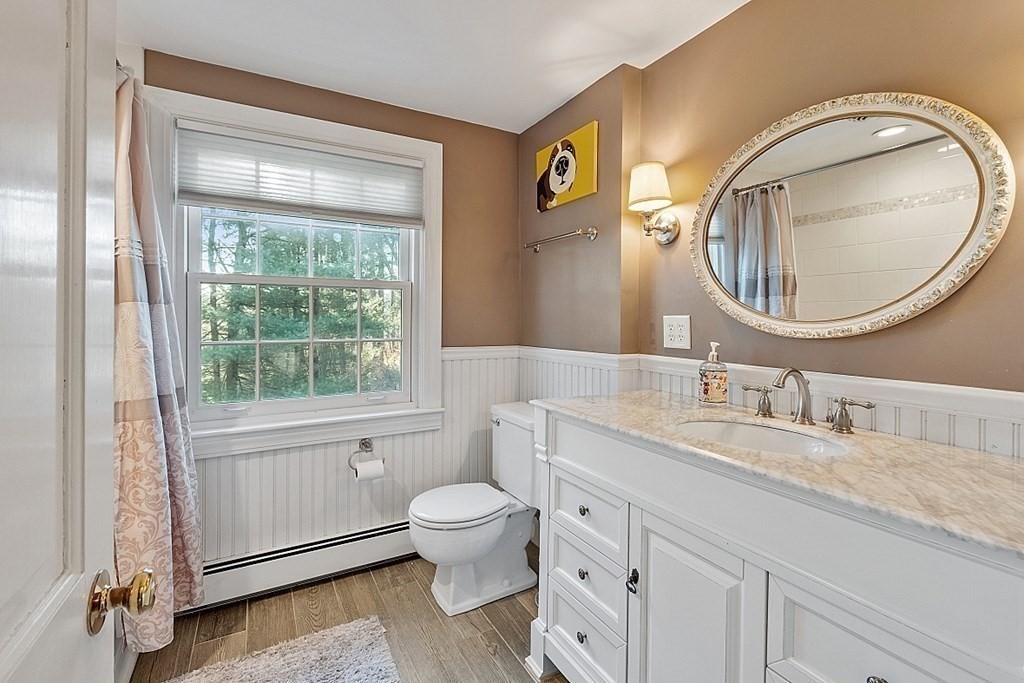2 Joseph Reed Lane Acton, MA 01720 - Photo 29 of 42 a bathroom with a granite countertop toilet a sink and a mirror