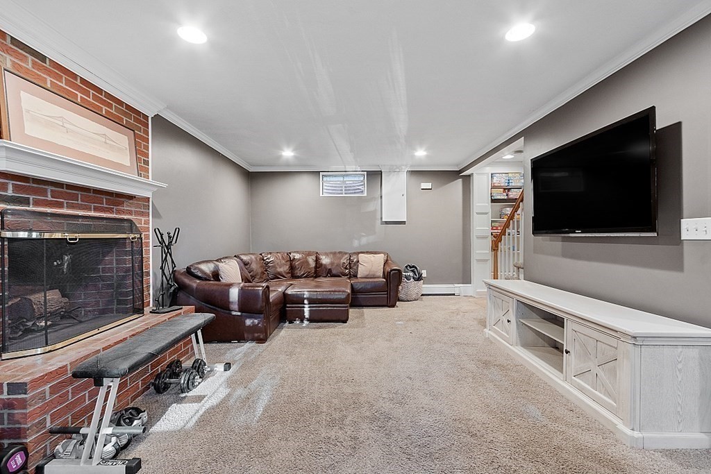 2 Joseph Reed Lane Acton, MA 01720 - Photo 31 of 42 a living room with furniture and a flat screen tv