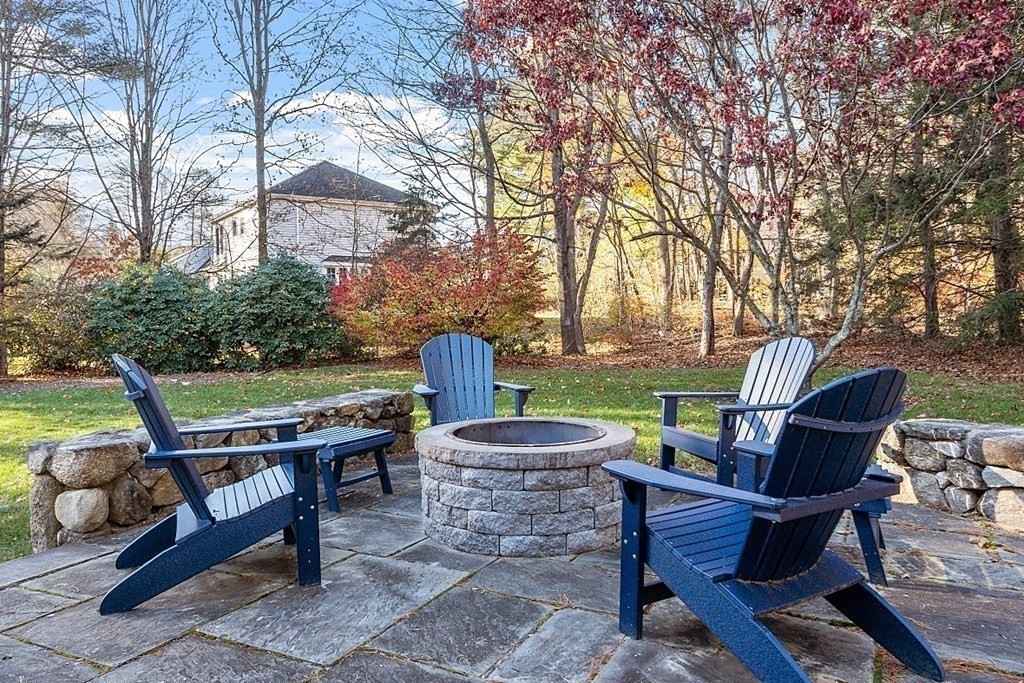 2 Joseph Reed Lane Acton, MA 01720 - Photo 37 of 42 a view of a patio with table and chairs potted plants and a large tree