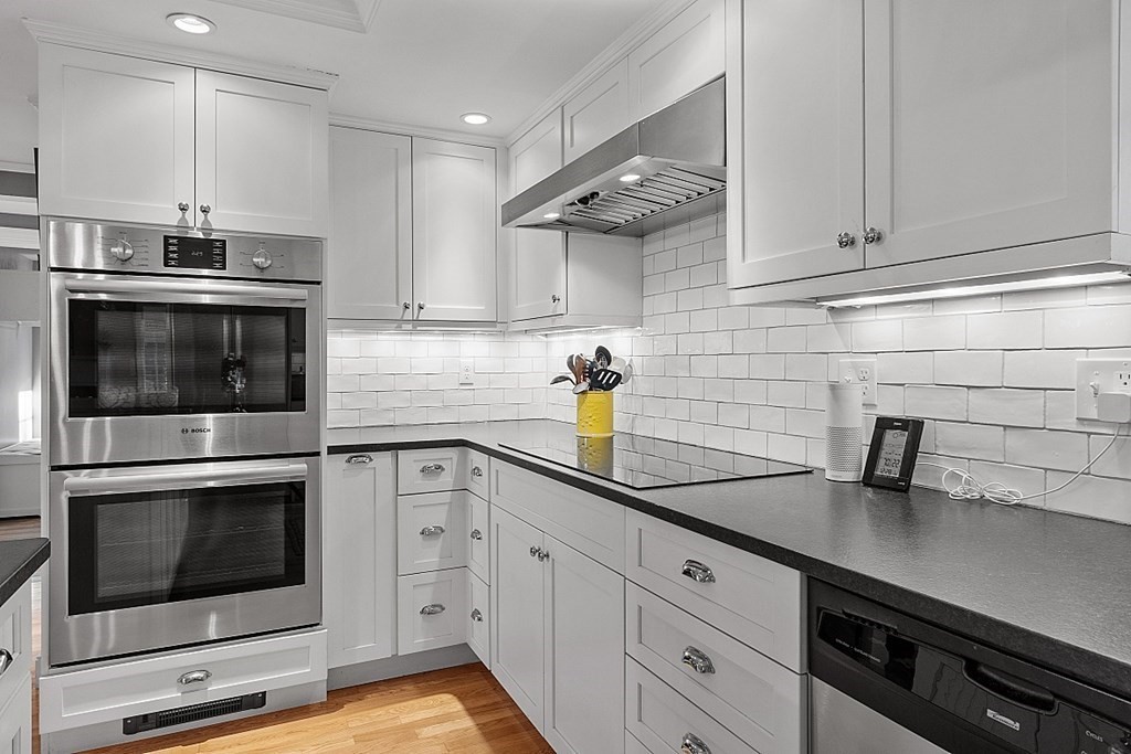 2 Joseph Reed Lane Acton, MA 01720 - Photo 5 of 42 a kitchen with cabinets stainless steel appliances and sink