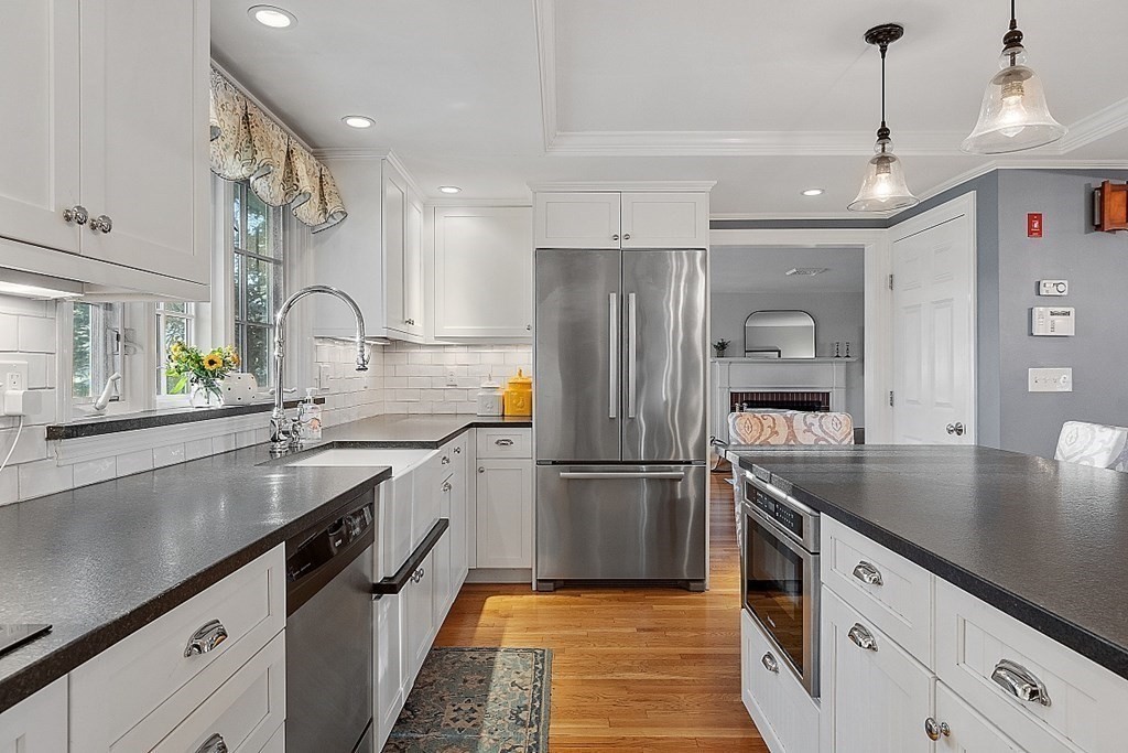 2 Joseph Reed Lane Acton, MA 01720 - Photo 6 of 42 a kitchen with stainless steel appliances granite countertop a sink a stove and a refrigerator