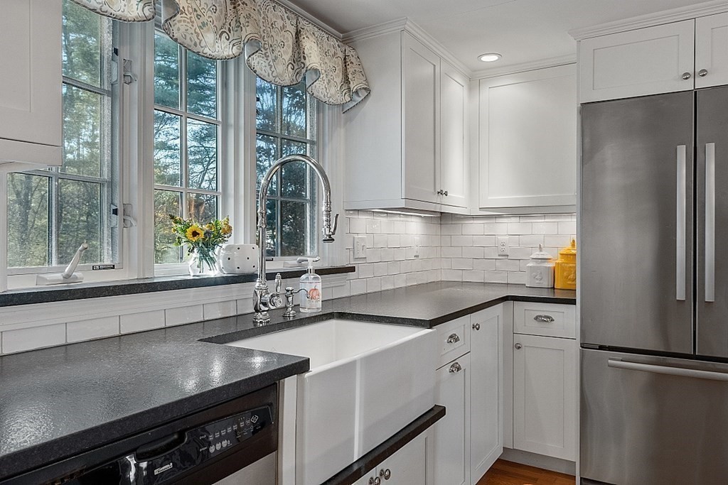 2 Joseph Reed Lane Acton, MA 01720 - Photo 7 of 42 a kitchen with stainless steel appliances a sink and a cabinets