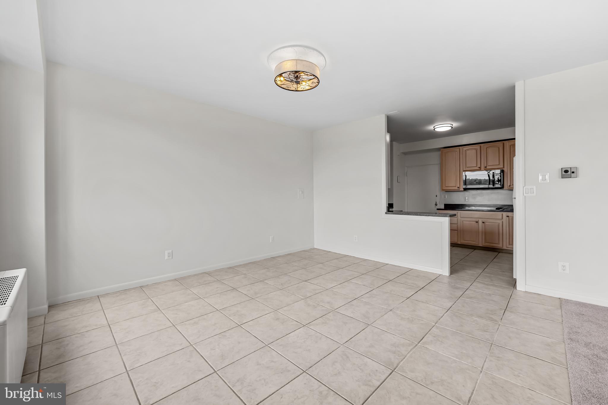 11 Slade Avenue, Unit 911 Baltimore, MD 21208 - Photo 15 of 32 a view of a kitchen with a sink