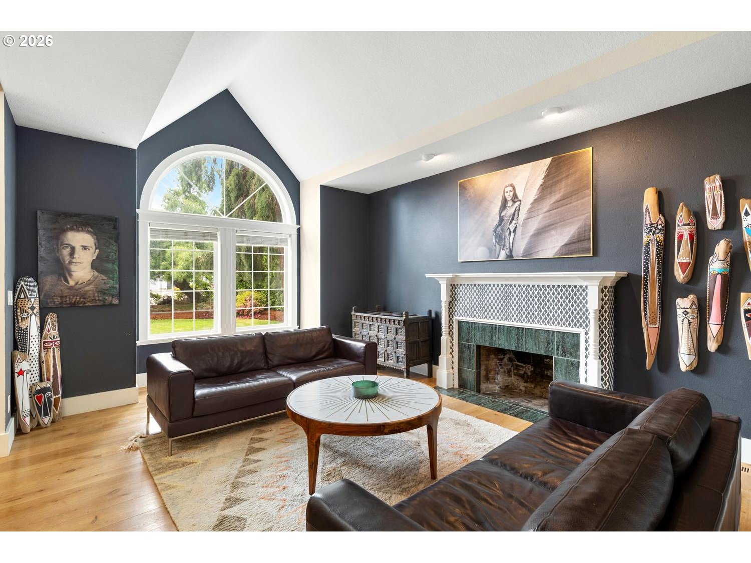 2519 Northwest 24th Circle Camas, WA 98607 - Photo 10 of 48 a living room with furniture a fireplace and a large window