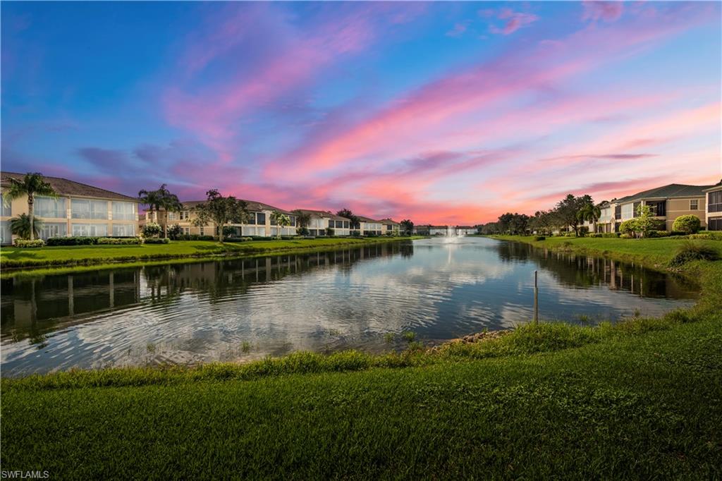 a view of a lake with a house in the background