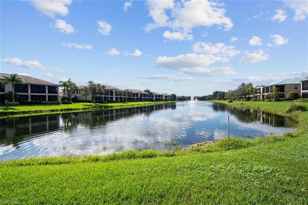 821 Regency Reserve Circle, Unit 3802 Naples, FL 34119 - Photo 25 of 26 a view of a lake with houses