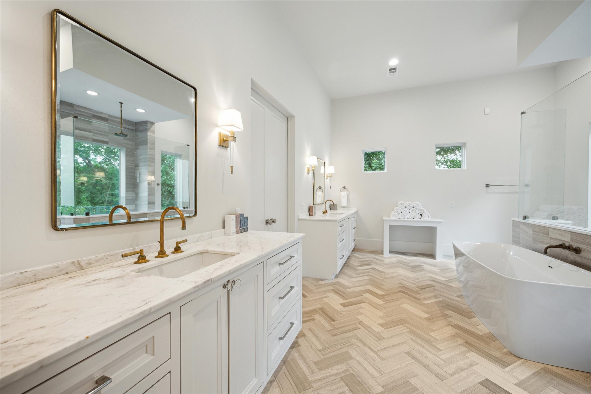22 East Shady Lane, Unit E Houston, TX 77063 - Photo 23 of 50 a spacious bathroom with a double vanity sink a mirror and a bathtub