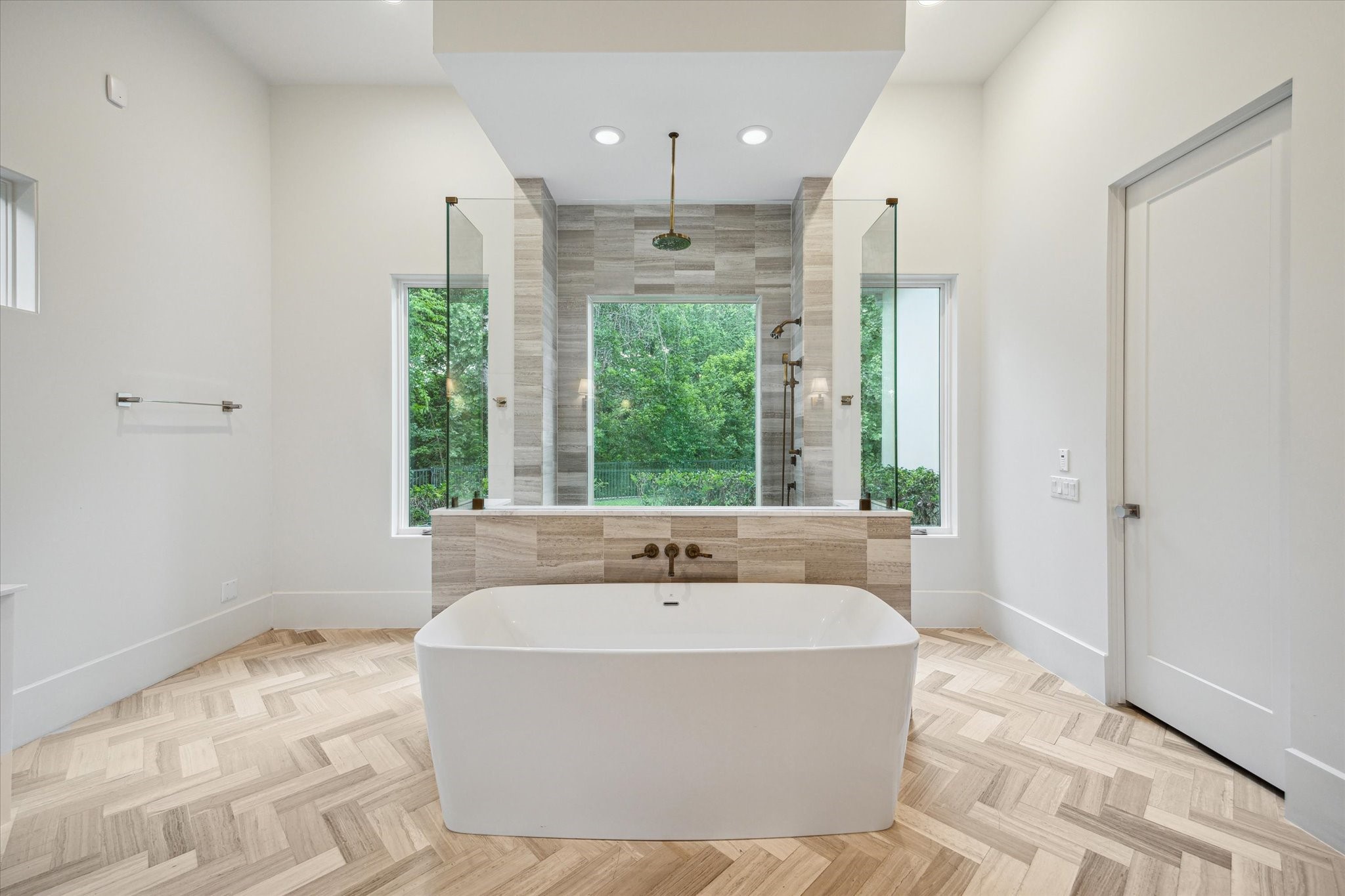 22 East Shady Lane, Unit E Houston, TX 77063 - Photo 24 of 50 a white bath tub sitting in a bathroom next to a window