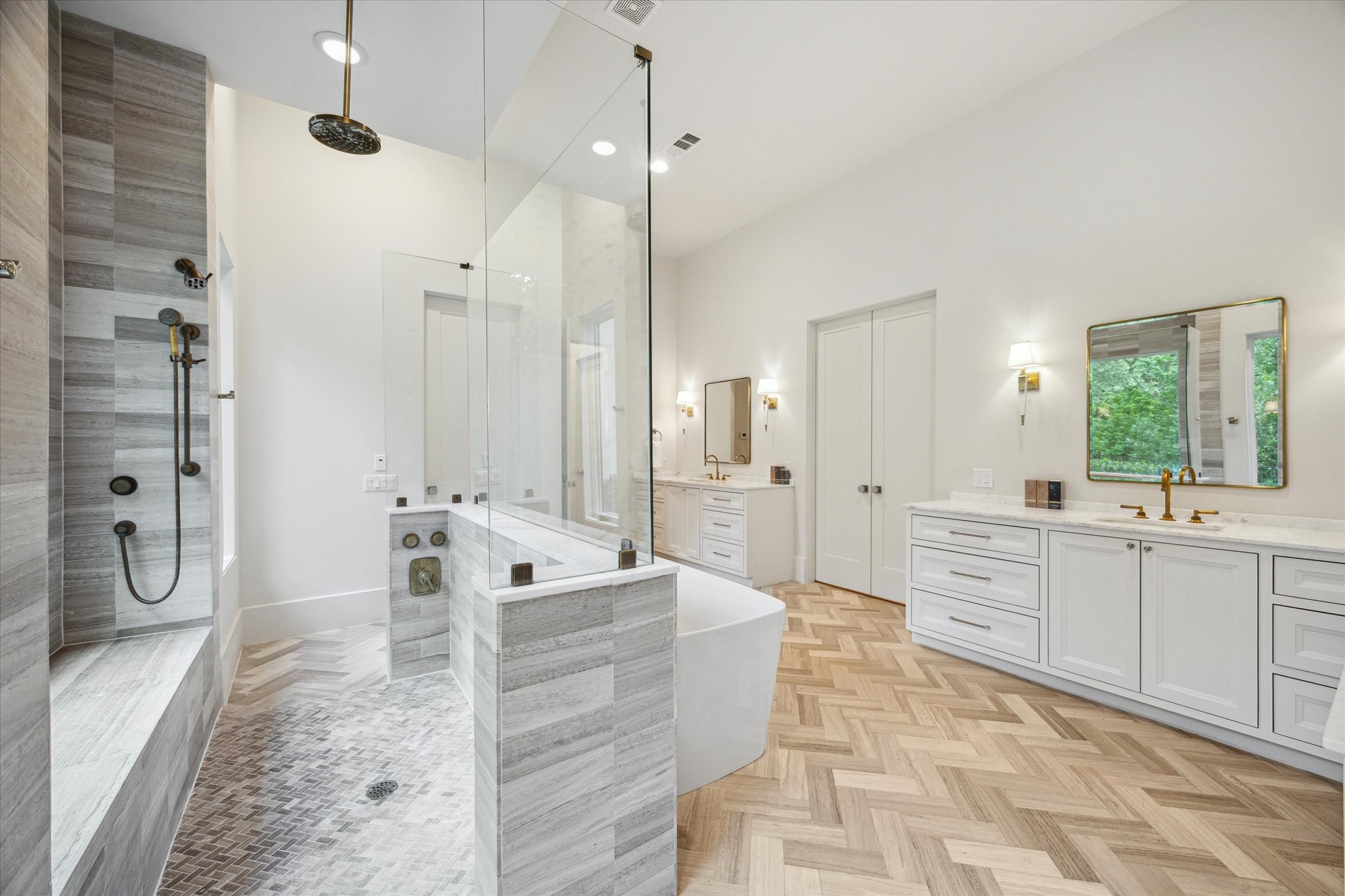 22 East Shady Lane, Unit E Houston, TX 77063 - Photo 25 of 50 a large white bathroom with a granite countertop sink a mirror a bathtub and shower
