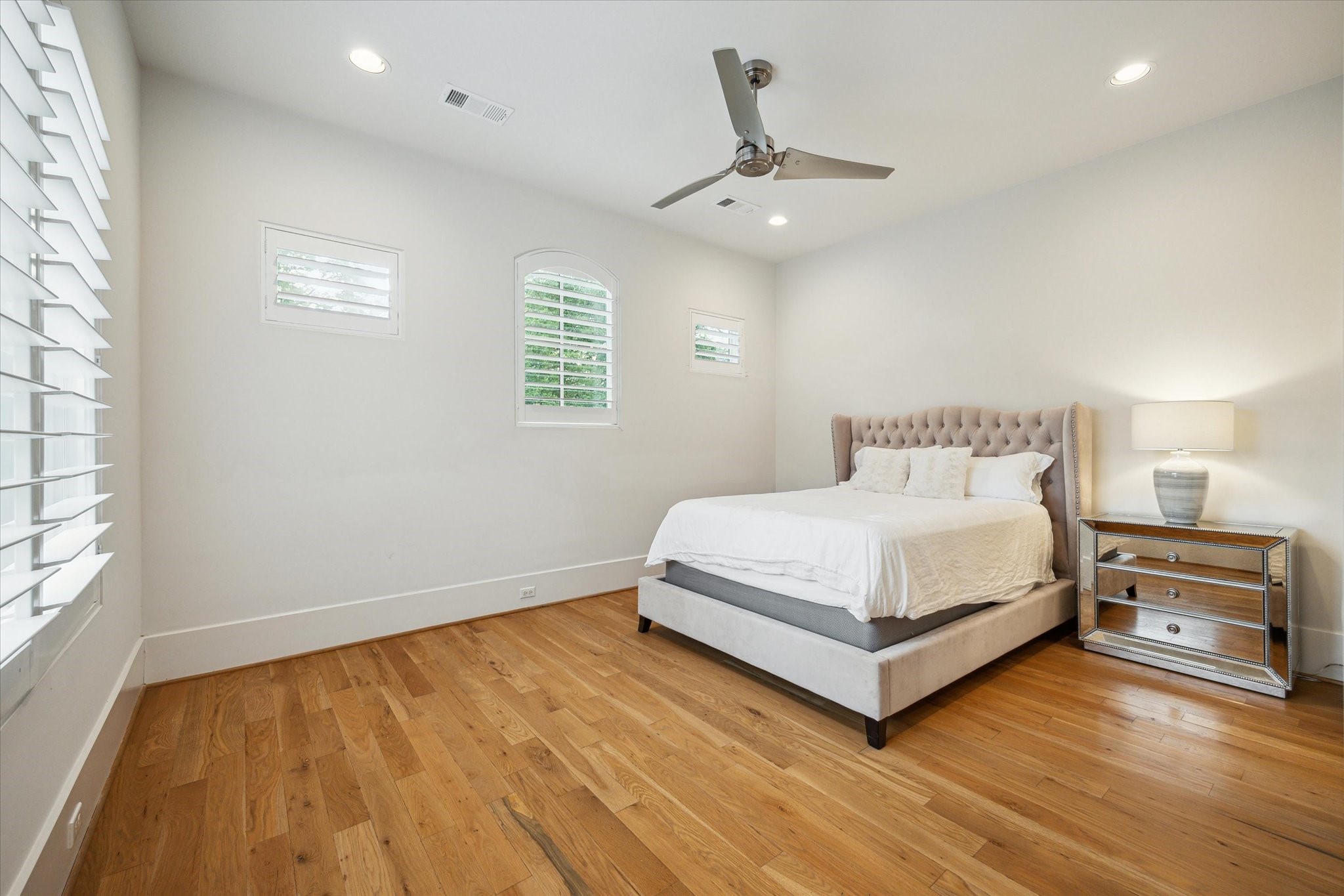 22 East Shady Lane, Unit E Houston, TX 77063 - Photo 33 of 50 a bedroom with a bed and window