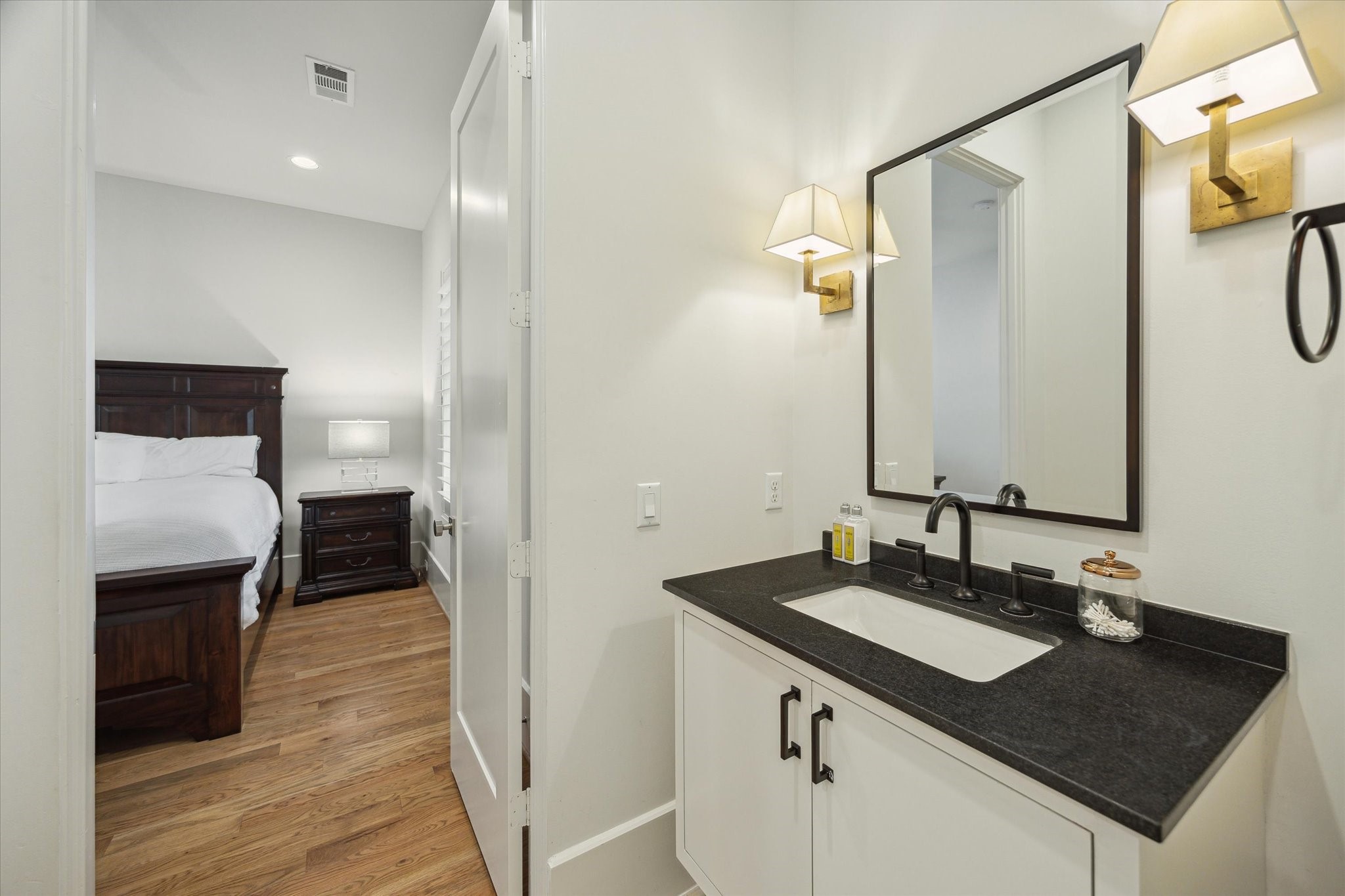 22 East Shady Lane, Unit E Houston, TX 77063 - Photo 35 of 50 a bathroom with a sink double vanity and a mirror
