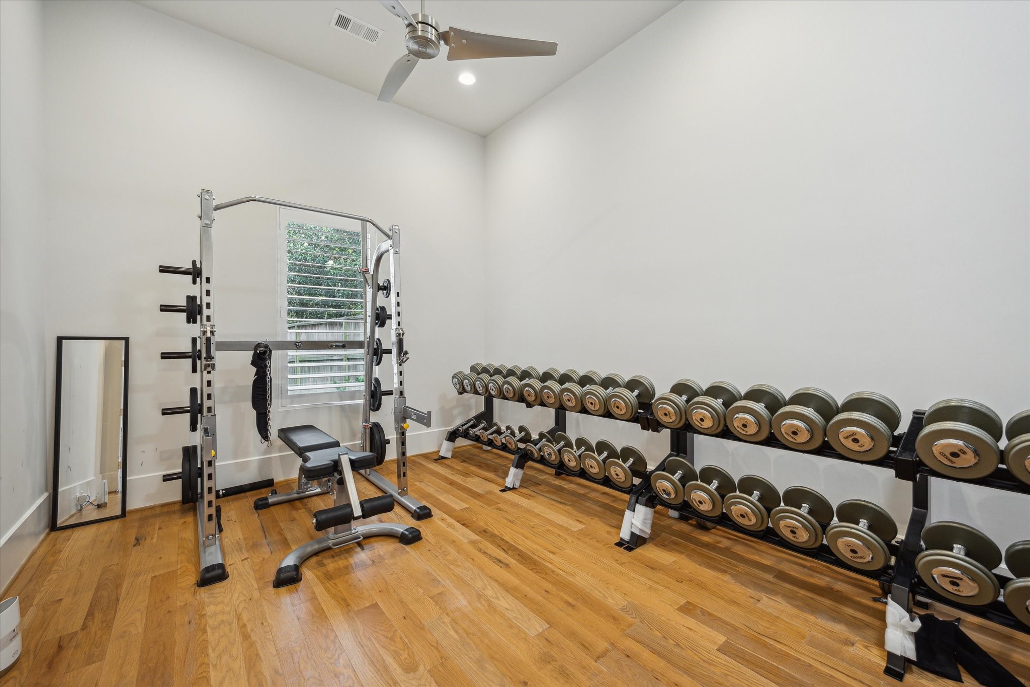 22 East Shady Lane, Unit E Houston, TX 77063 - Photo 37 of 50 a view of a room with gym equipment