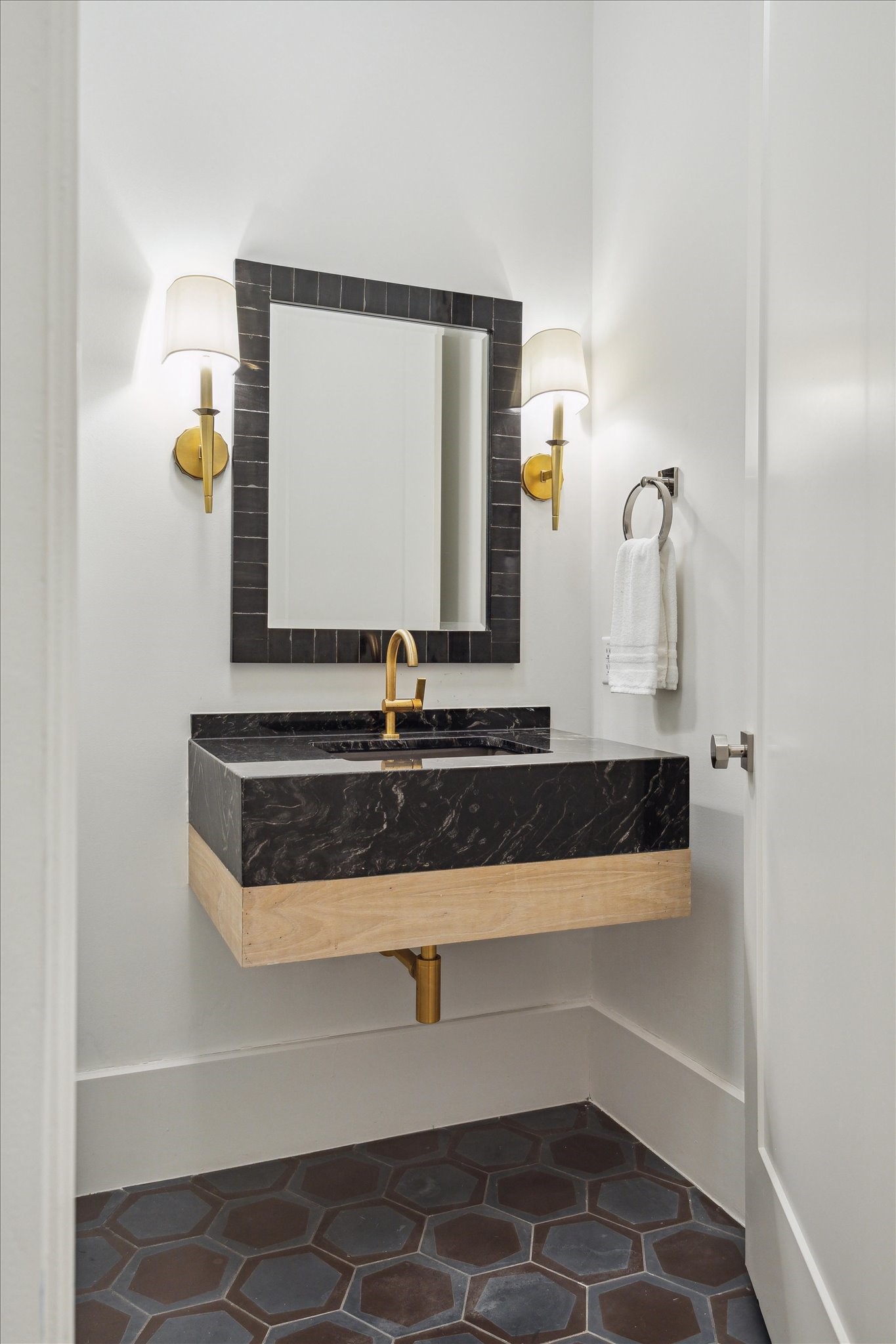 22 East Shady Lane, Unit E Houston, TX 77063 - Photo 40 of 50 a bathroom with a sink and a mirror