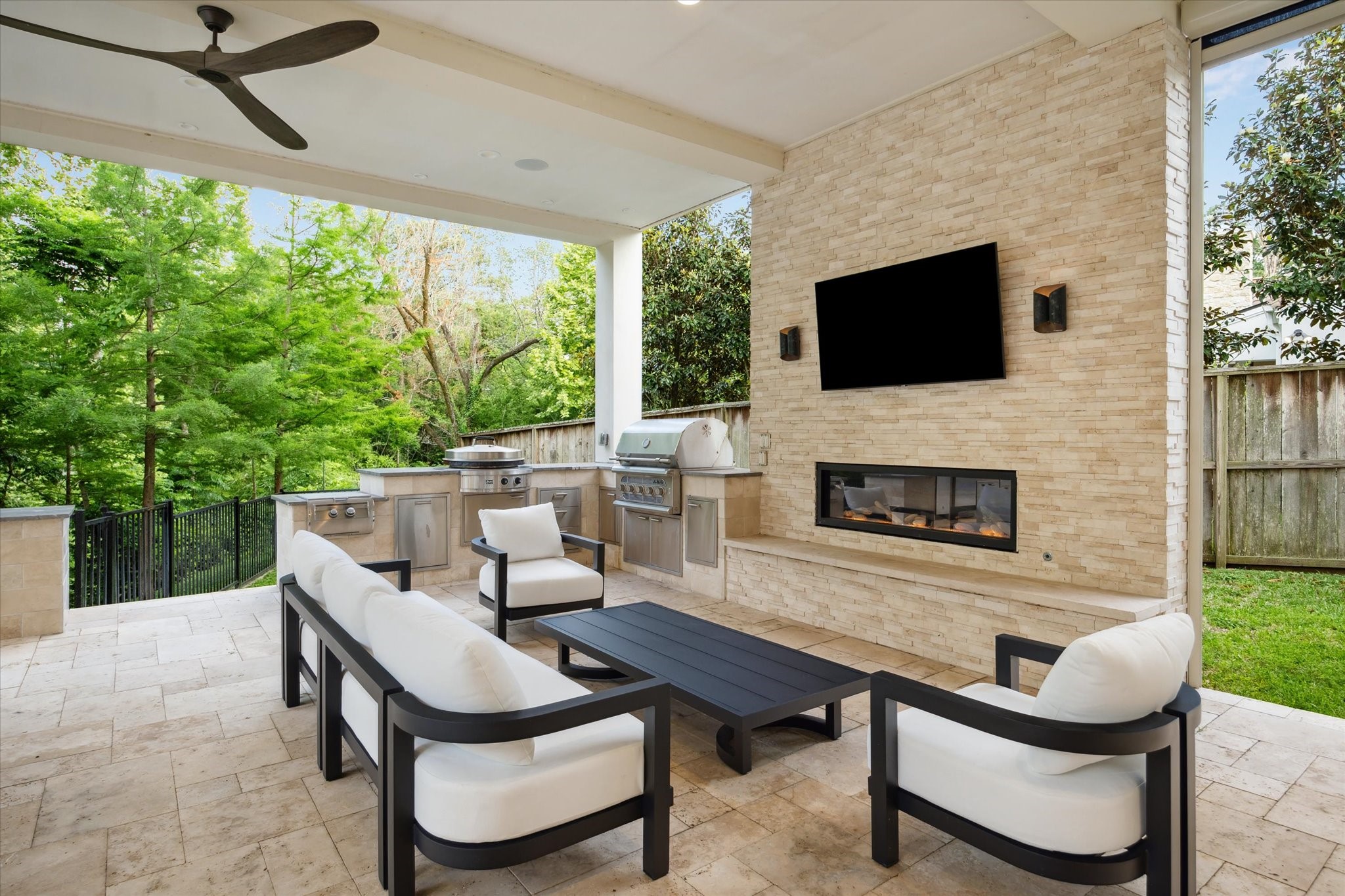 22 East Shady Lane, Unit E Houston, TX 77063 - Photo 41 of 50 a outdoor living space with furniture and a fireplace