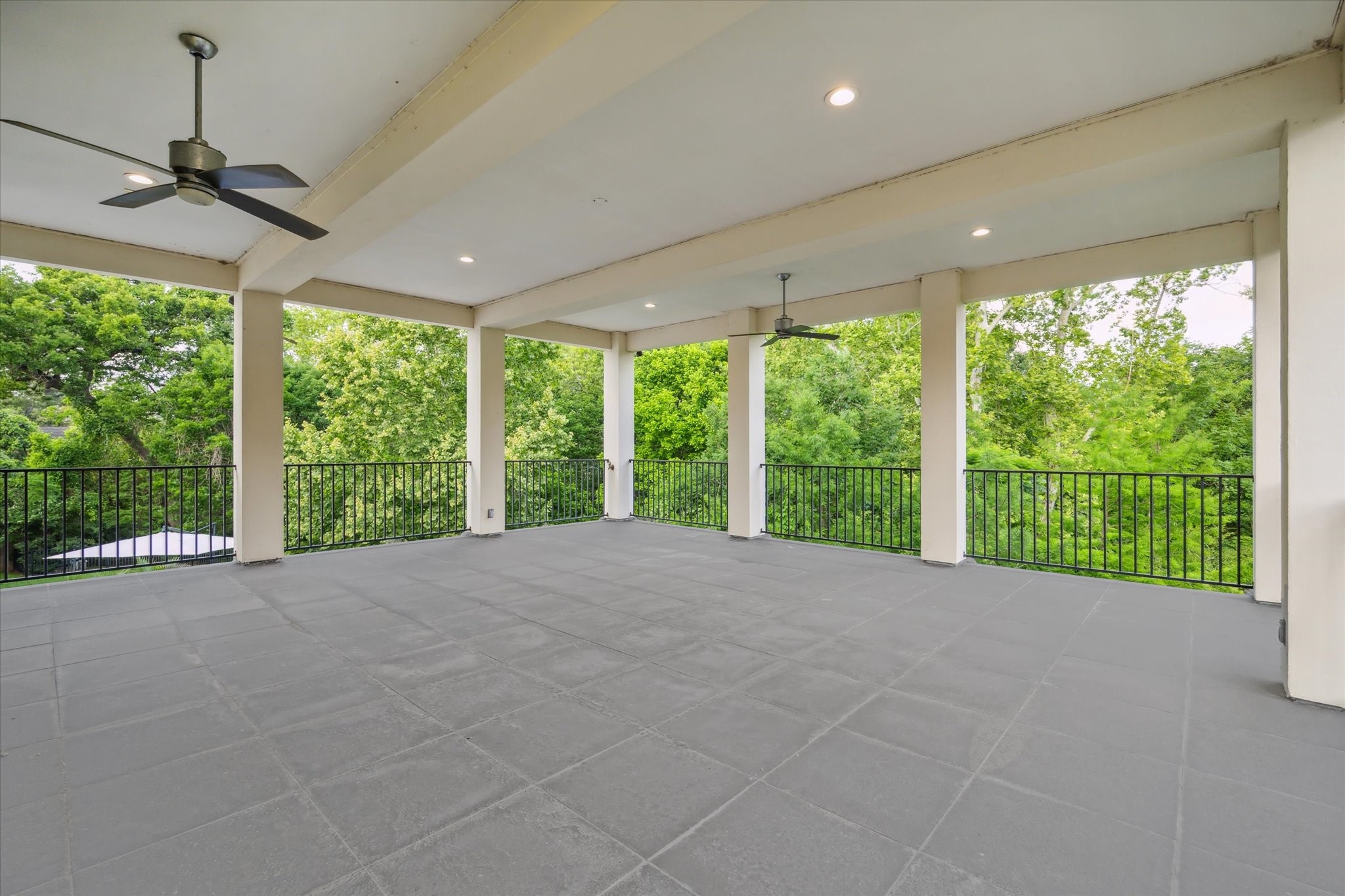 22 East Shady Lane, Unit E Houston, TX 77063 - Photo 46 of 50 a view of an empty room with a large window