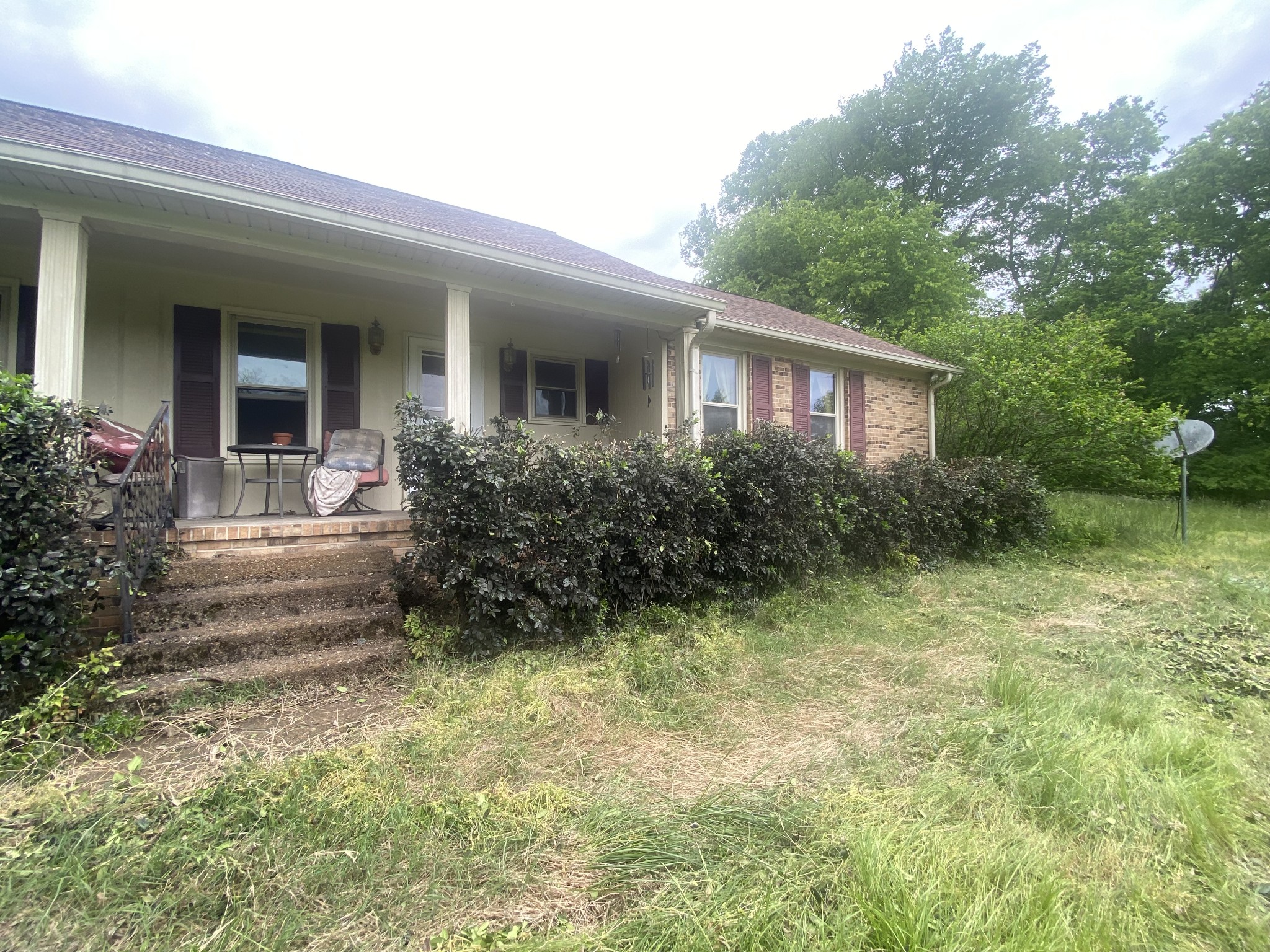 2255 Arthur Hutcherson Road Columbia, TN 38401 - Photo 3 of 13 a view of house in front of a yard with potted plants