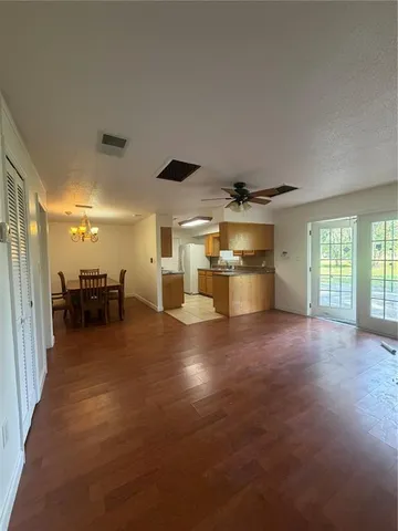 a view of a livingroom with a kitchen
