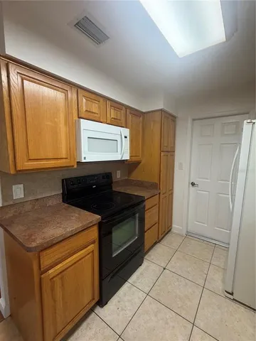 a kitchen with a stove and a sink