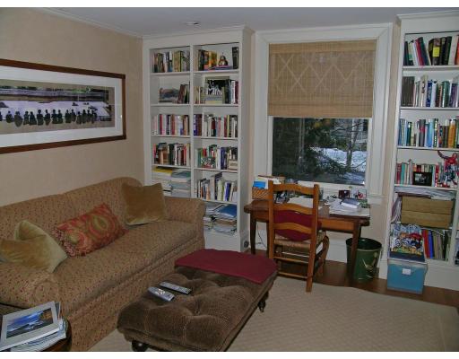 162 Middlesex Road Chestnut Hill, MA 02467 - Photo 13 of 22 a living room with furniture a bookshelf and a window