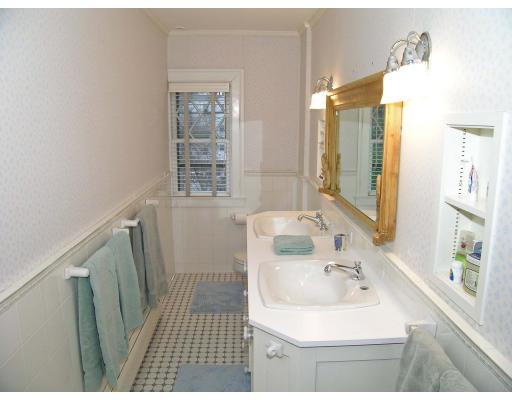 162 Middlesex Road Chestnut Hill, MA 02467 - Photo 16 of 22 a bathroom with a sink a toilet a mirror and shower