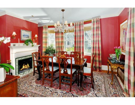 162 Middlesex Road Chestnut Hill, MA 02467 - Photo 6 of 22 a dining room with furniture a chandelier and a fireplace