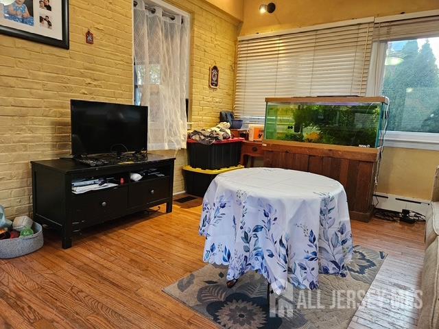 78 Schoder Avenue Woodbridge, NJ 07095 - Photo 19 of 26 a living room with furniture and a flat screen tv