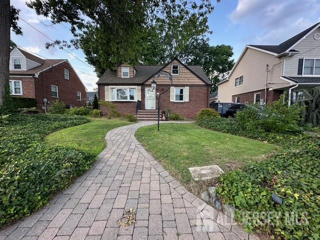 78 Schoder Avenue Woodbridge, NJ 07095 - Photo 2 of 26 a front view of a house with yard