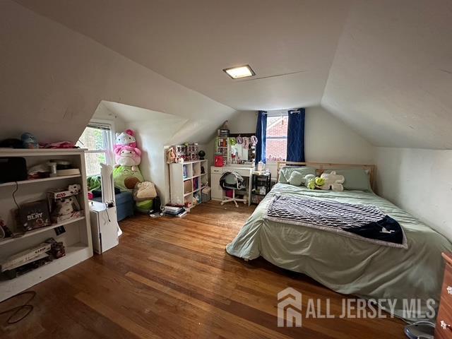 78 Schoder Avenue Woodbridge, NJ 07095 - Photo 21 of 26 a bedroom with furniture and a wooden floor